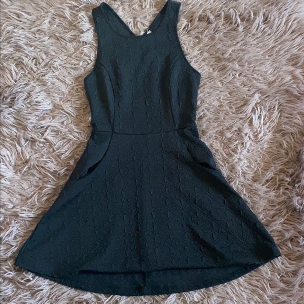 Black textured mini dress with pockets